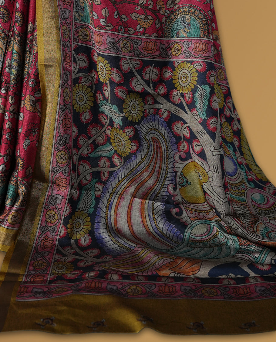 Reddish maroon colour saree adorned with intricate floral and paisley motifs, featuring a vibrant Madhubani style pallu and olive gold border & Paired with a matching blouse.