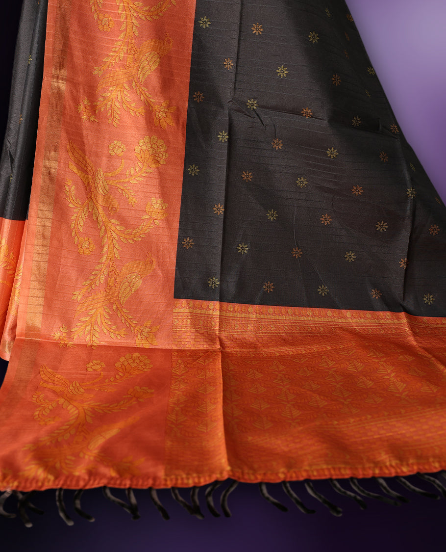 Grey & orange saree adorned with golden buttas, complemented by a rich orange zari border and pallu with floral motifs, paired with a matching blouse.