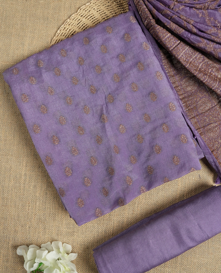 Lavender colour suit material adorned with delicate light copper toned zari work & Comes with a beautifully woven dupatta and matching plain bottom fabric.