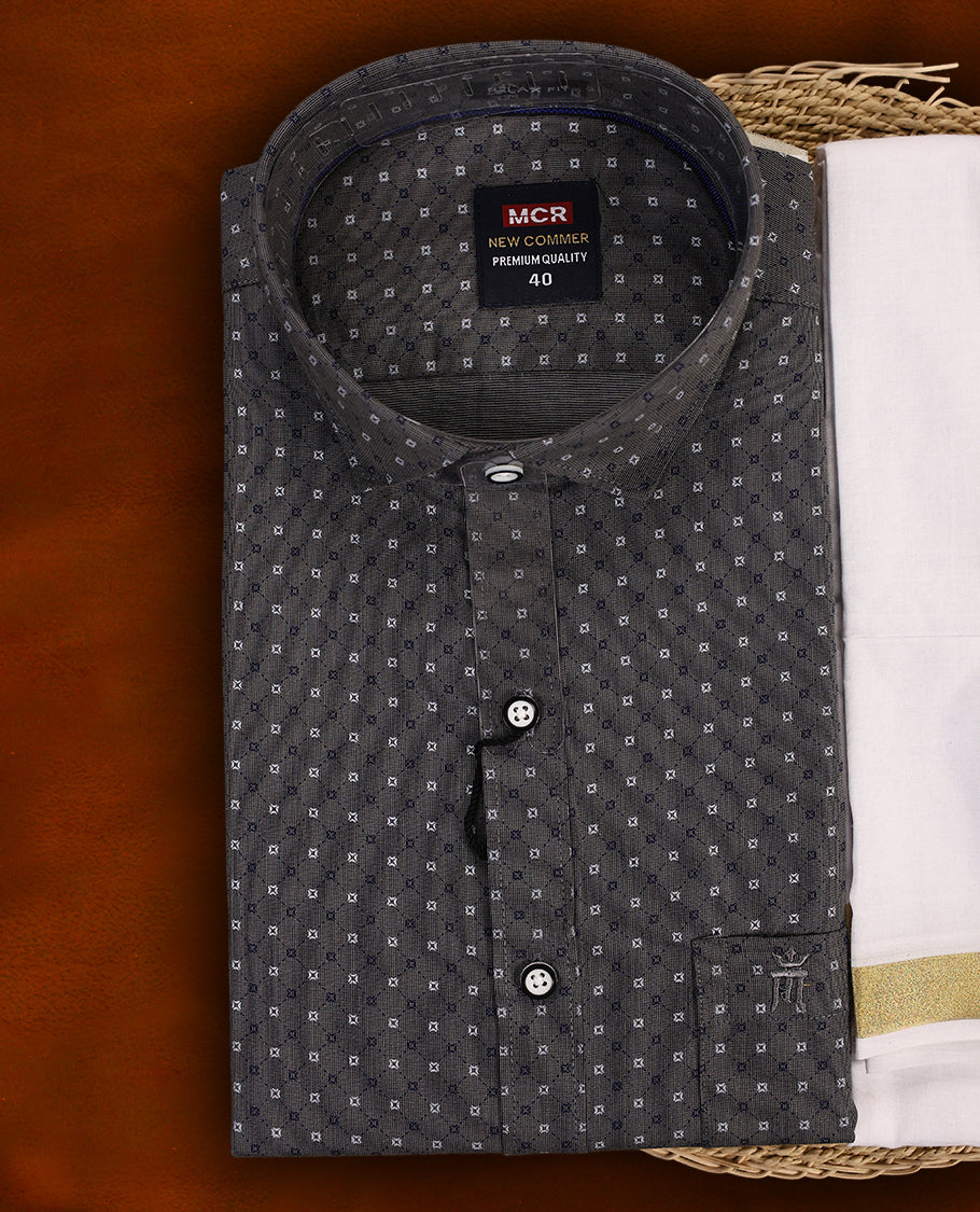 Dark grey colour MCR printed shirt featuring subtle all over motifs, paired with a white dhoti highlighted with an elegant golden zari kara and a matching dark grey printed border.