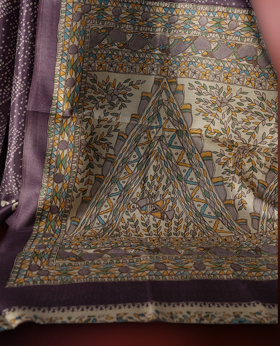 Light Wine colour saree adorned with intricate beige bandhani patterns and a contrasting pallu featuring exquisite beige floral motifs, perfectly paired with a matching blouse for a regal look.