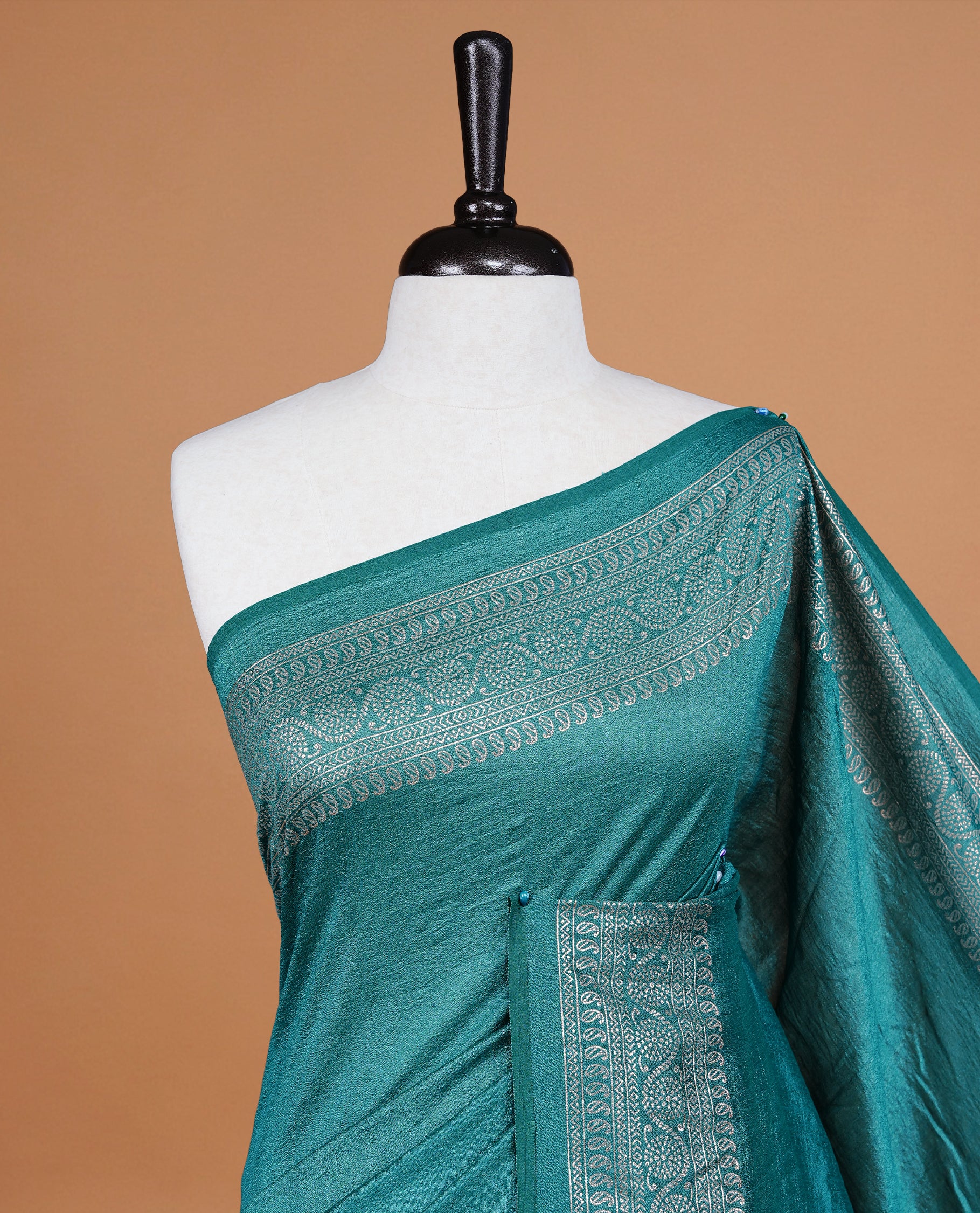 Aqua colour semi silk saree featuring Elegant plain body with fancy border, comes with matching self colour blouse piece.