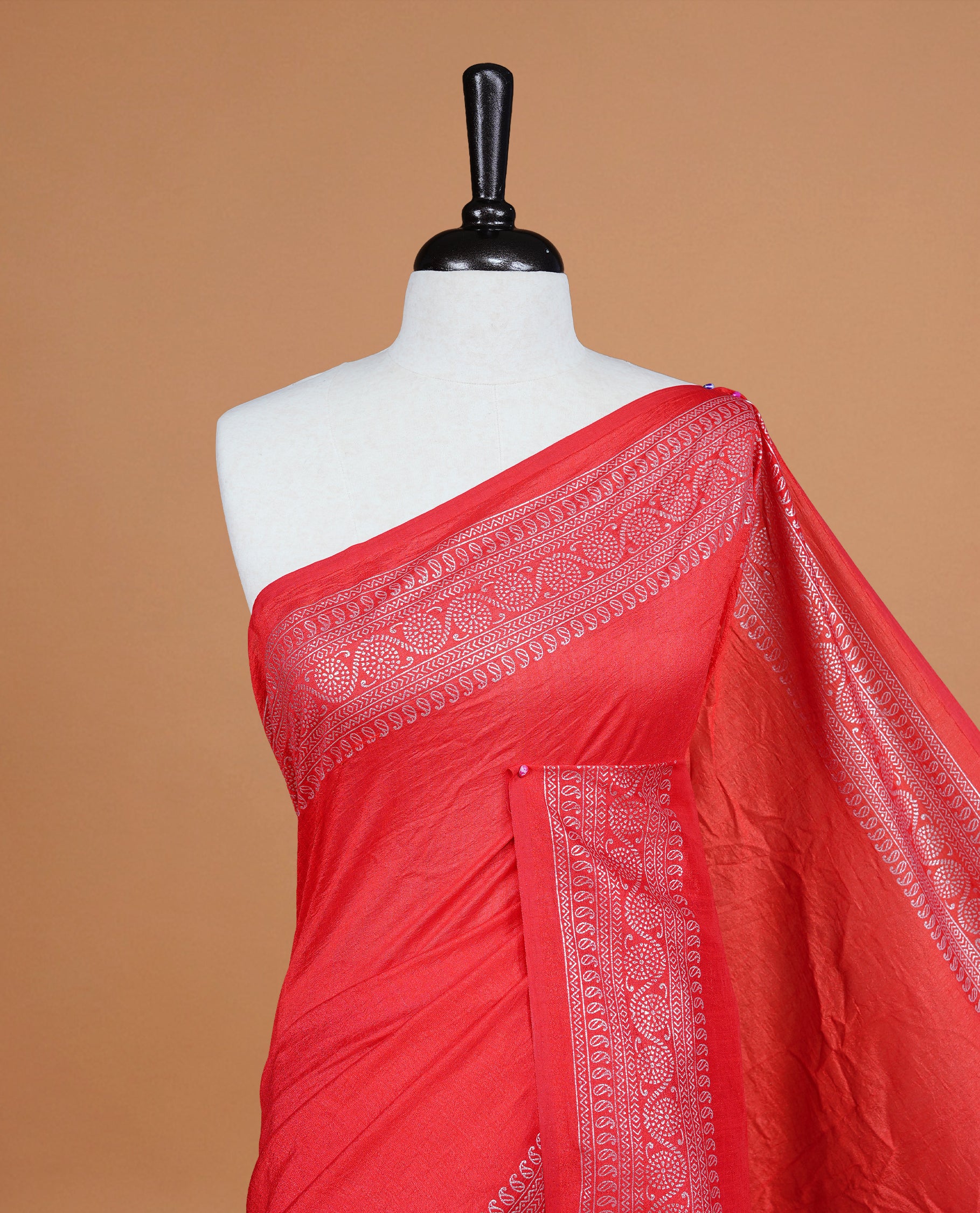 Red colour semi silk saree featuring Elegant plain body with fancy border, comes with matching self colour blouse piece.