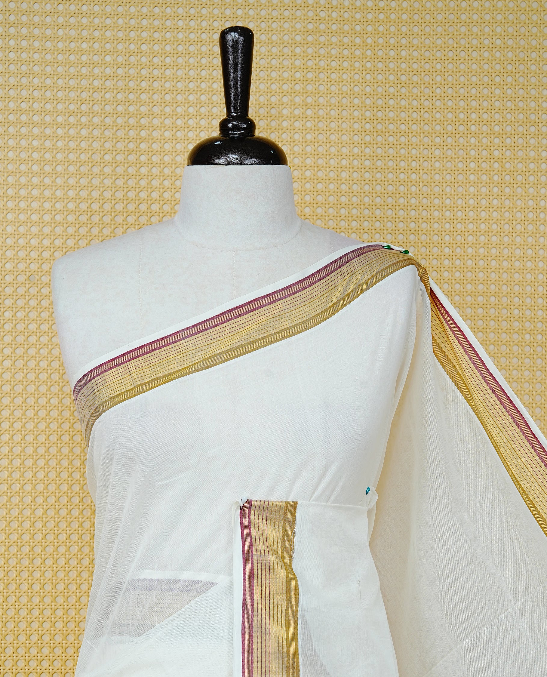 Cream Colour Cotton Kerala Saree Featuring a Plain Body, Enhanced with a Gold Zari and Maroon Border, Traditional Gold Zari Pallu, and a Matching Blouse Piece.