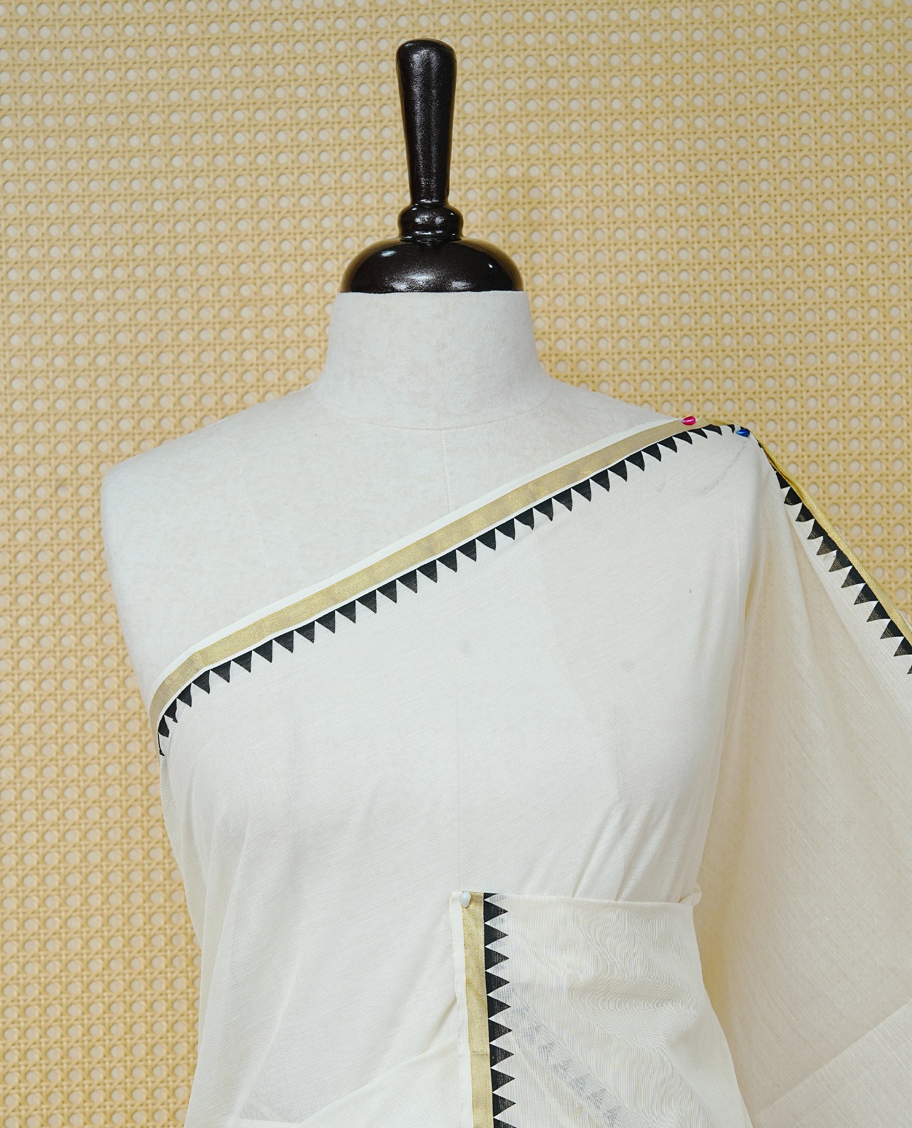 Cream Colour Cotton Kerala Saree Featuring A Gold Zari Border And Black Temple Edging, Paired With A Matching Blouse Piece