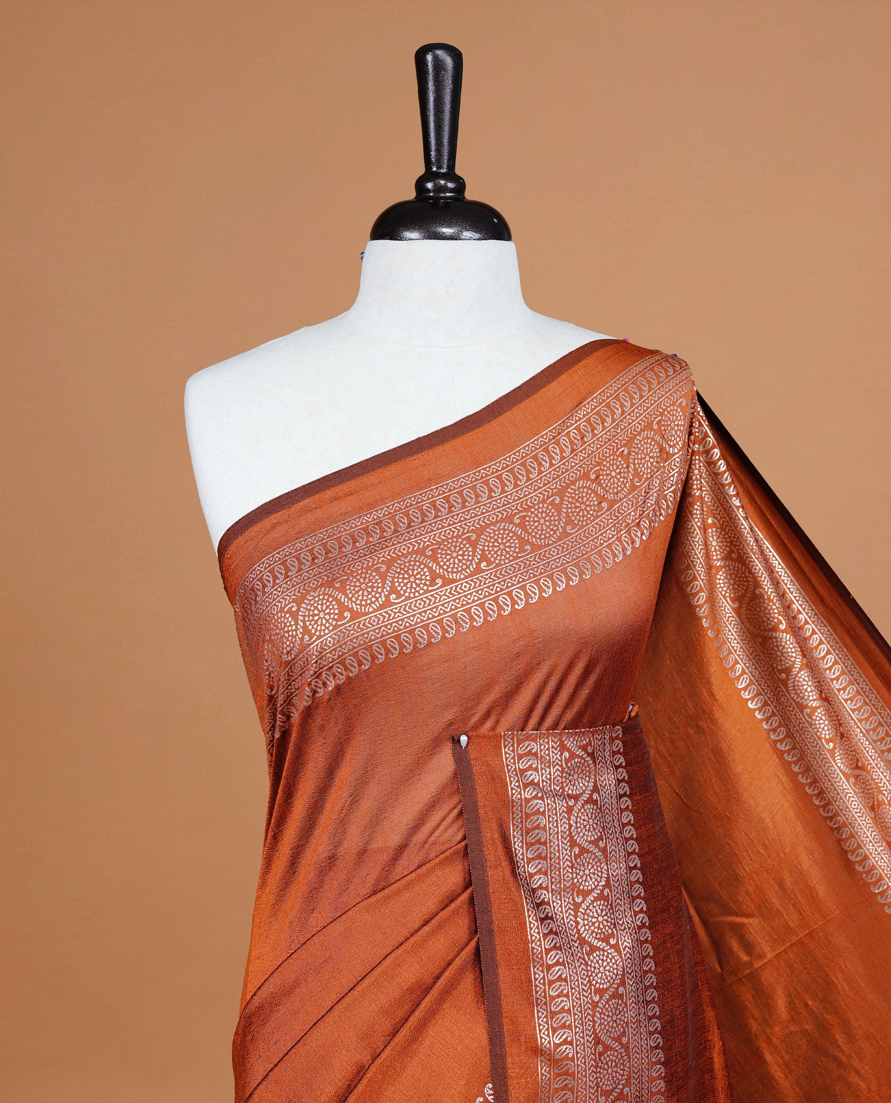 Rust Orange colour semi silk saree featuring Elegant plain body with fancy border, comes with matching self colour blouse piece.