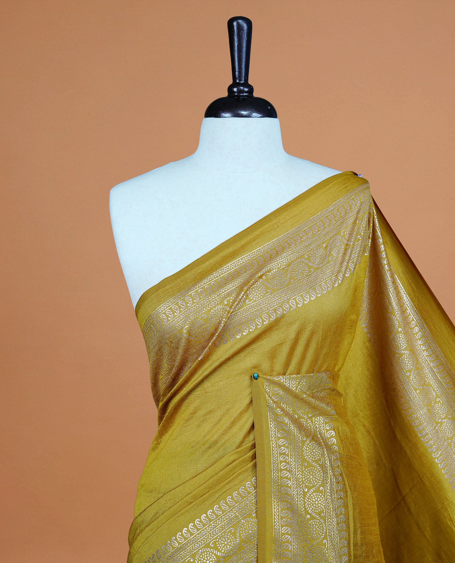 Mustard colour semi silk saree featuring Elegant plain body with fancy border, comes with matching self colour blouse piece.