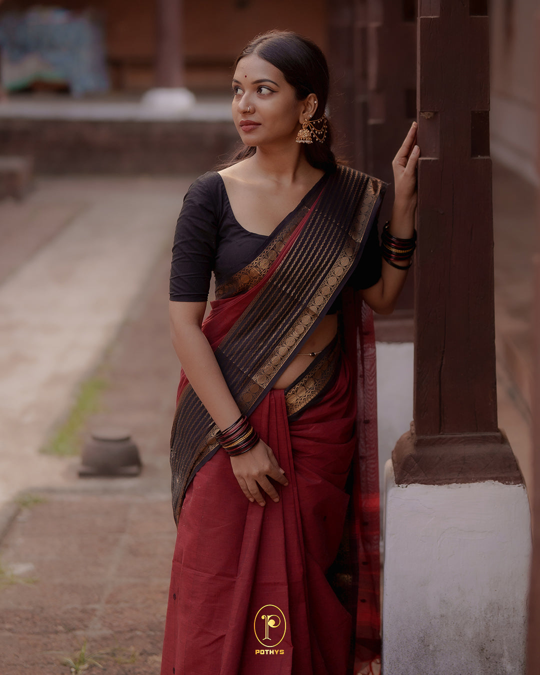 Brick Red colour Chettinad cotton saree with a plain body, featuring a traditional border and pallu in Dark Brown colour, paired with a matching blouse piece