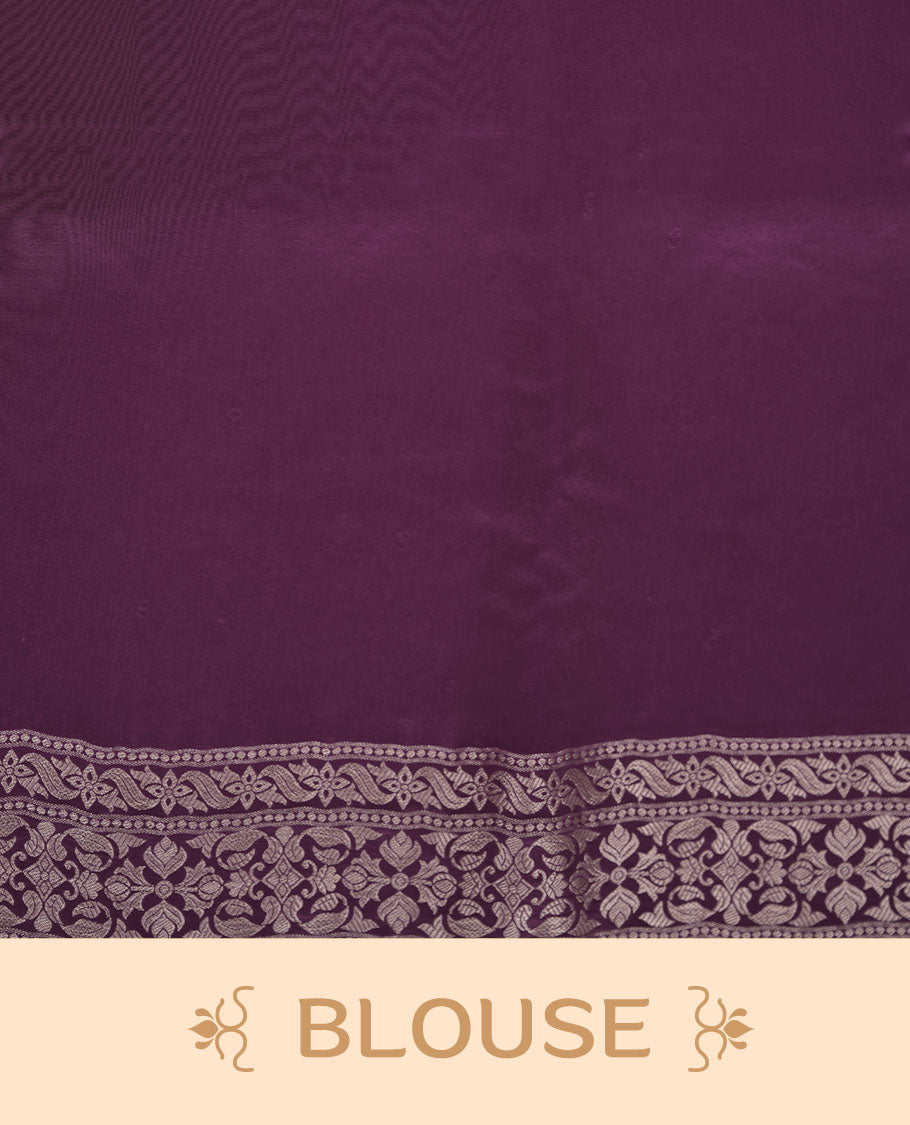Grape colour banaras satin crepe saree featuring gold zari pattern across body, with self colour border with gold zari pattern and paired with matching blouse.