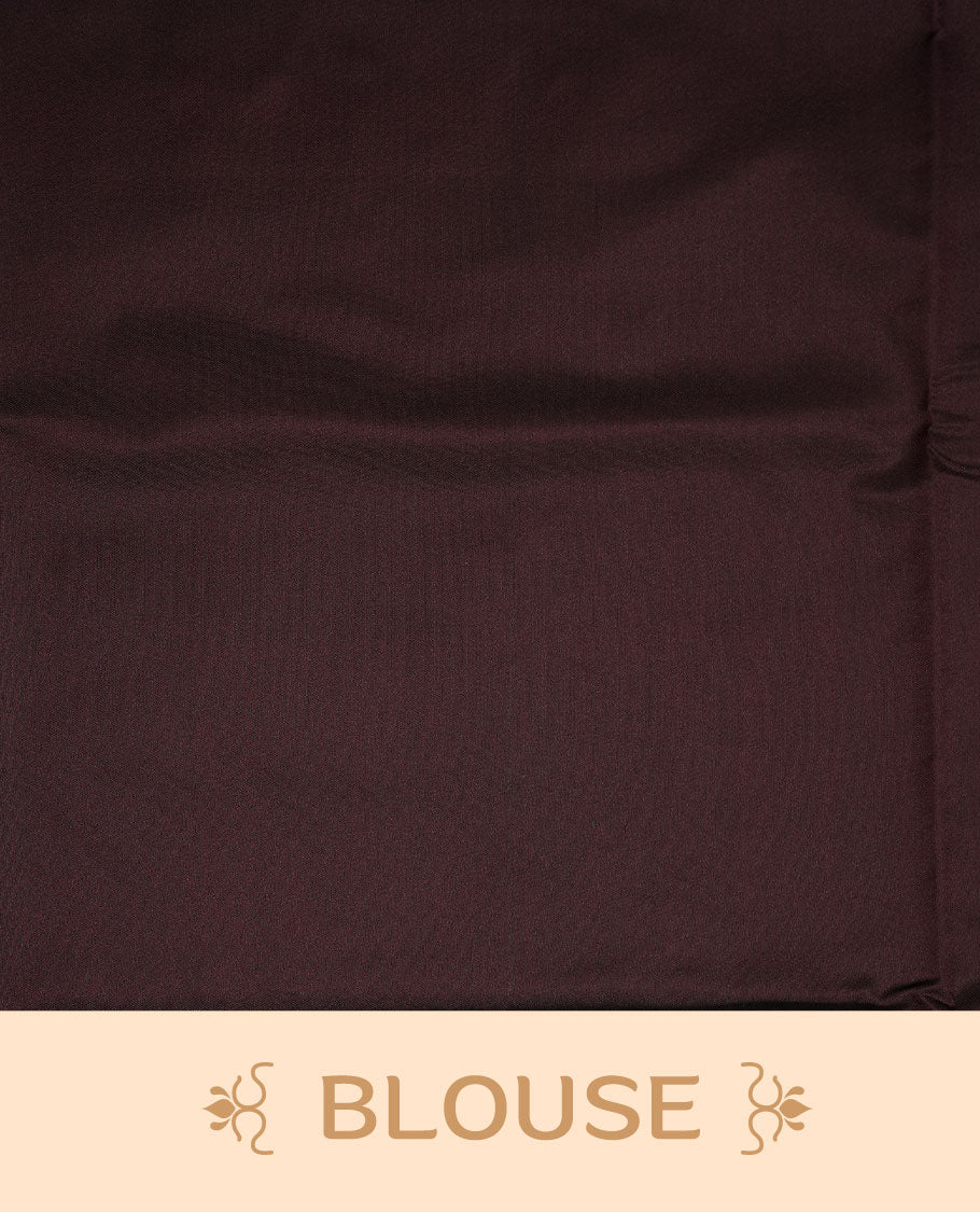 Green colour soft silk saree features a sleek borderless design with intricate antique zari motifs, flowing into a striking contrast chocolate brown pallu and a matching blouse piece.