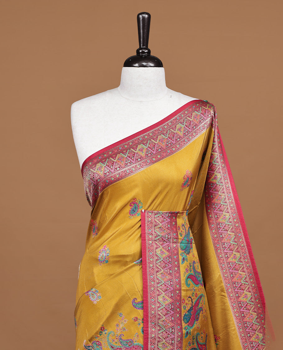 Mustard colour pashmina silk saree features all over motifs on body, contrast red with multi colour geometric border, paired with matching unstitched blouse blouse.
