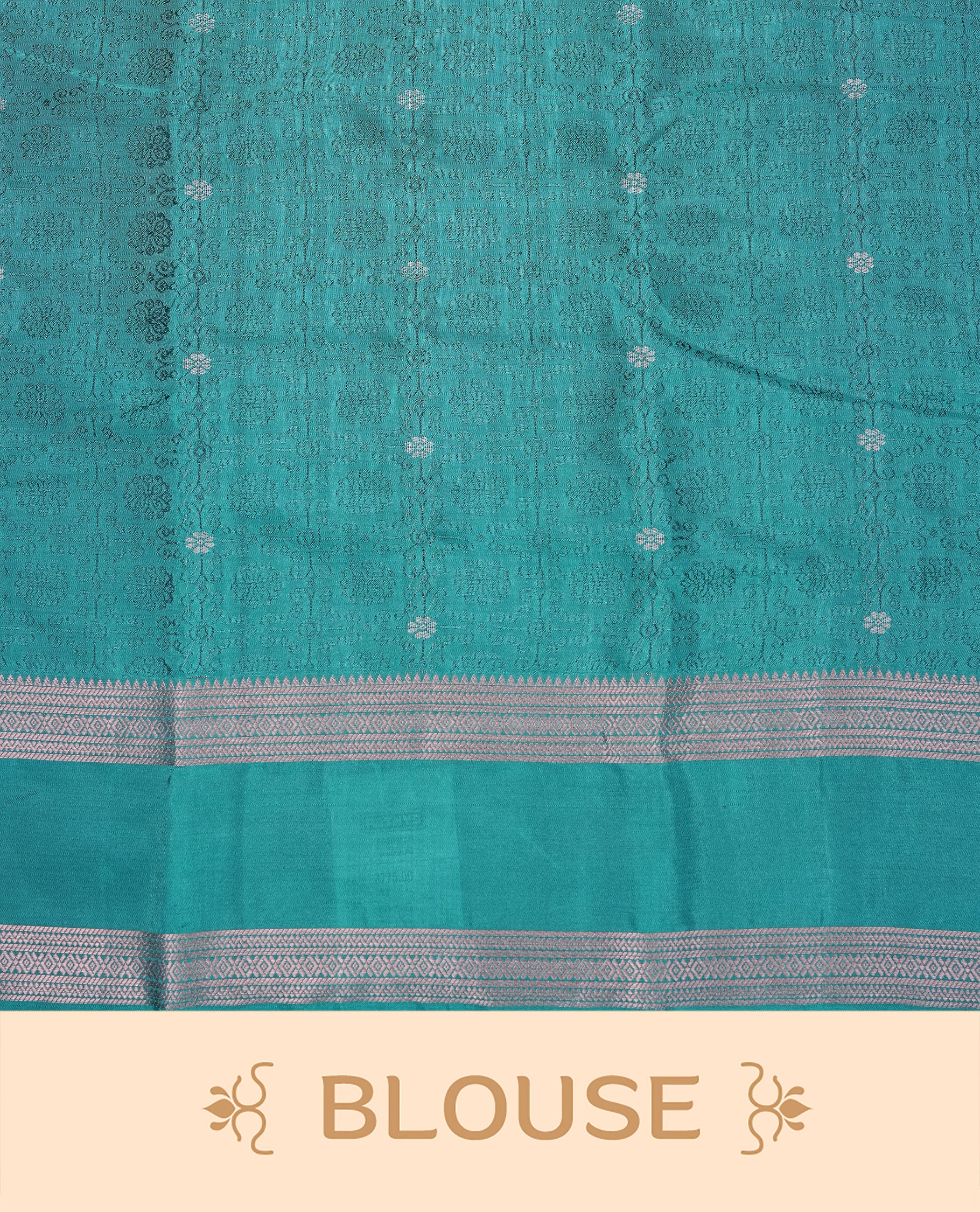 Teal Green Colour Semi Soft Slik Saree Featuring An Elegant Self Floral Woven Body, Enhanced By A Traditional Rose Gold Zari Border And Rich Pallu, Paired With A Matching Blouse Piece.