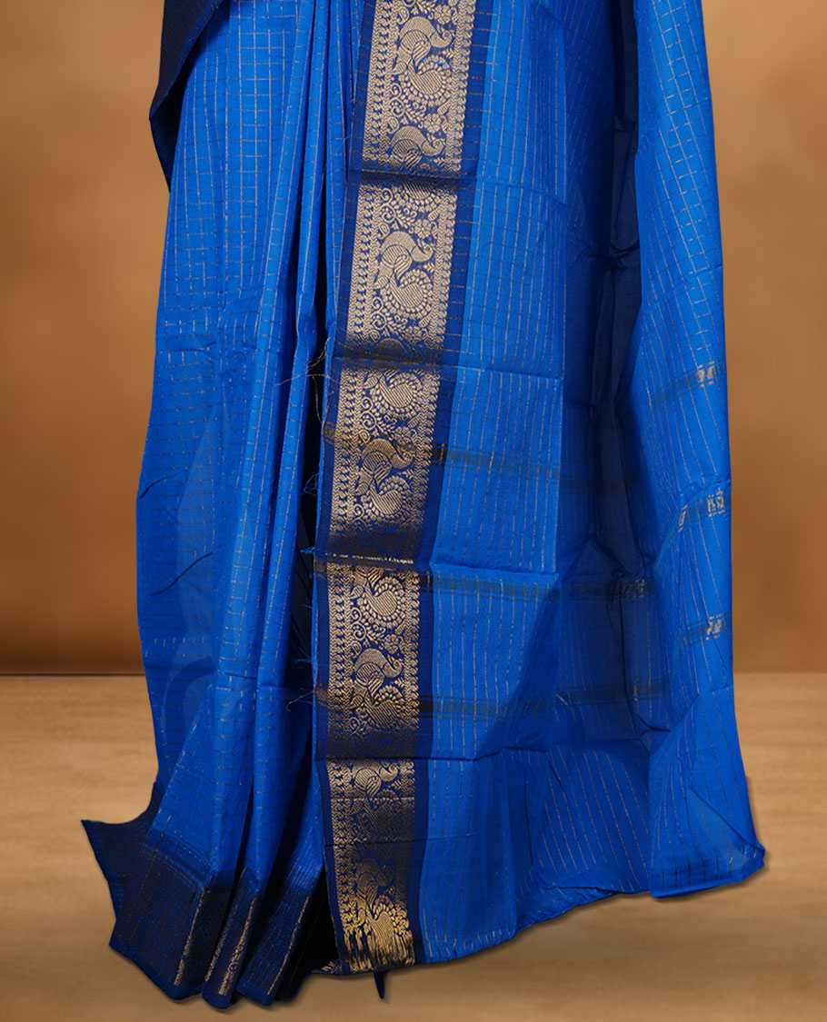 Blue colour chettinad cotton saree featuring gold zari check patterned body, paired with a dark blue colour traditional gold zari border without blouse.
