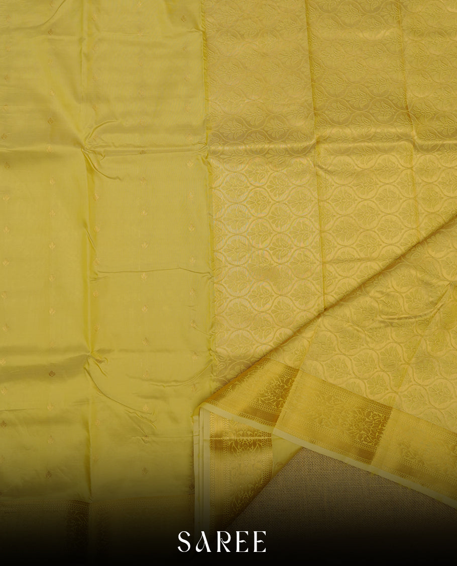 Gold colour shirt and dhoti with gold colour border, paired with matching colour silk saree featuring gold zari buttas and traditional border paired with matching blouse piece.