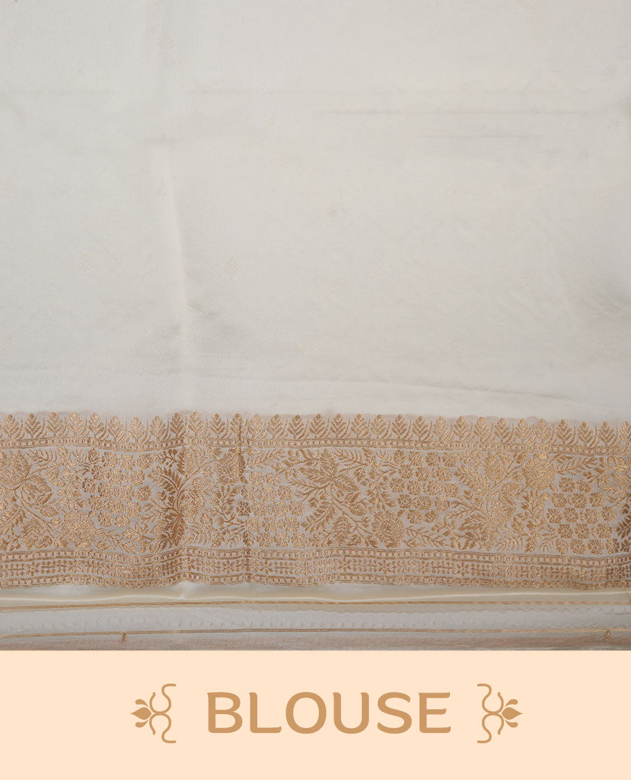 Chocolate brown colour banaras satin crepe saree featuring gold zari motifs on body, with contrast cream colour border with gold zari pattern and paired with matching blouse.