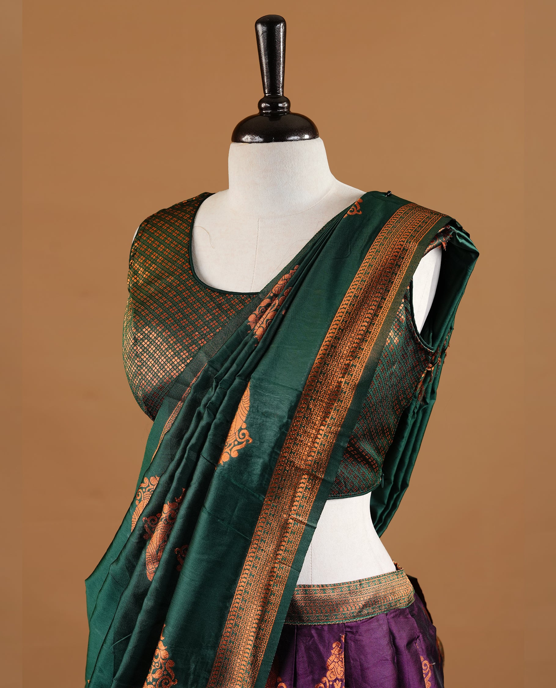 Green colour Half saree featuring Purple colour skirt with contrast green colour traditional border, paired with matching stitched blouse, contrast green dupatta.