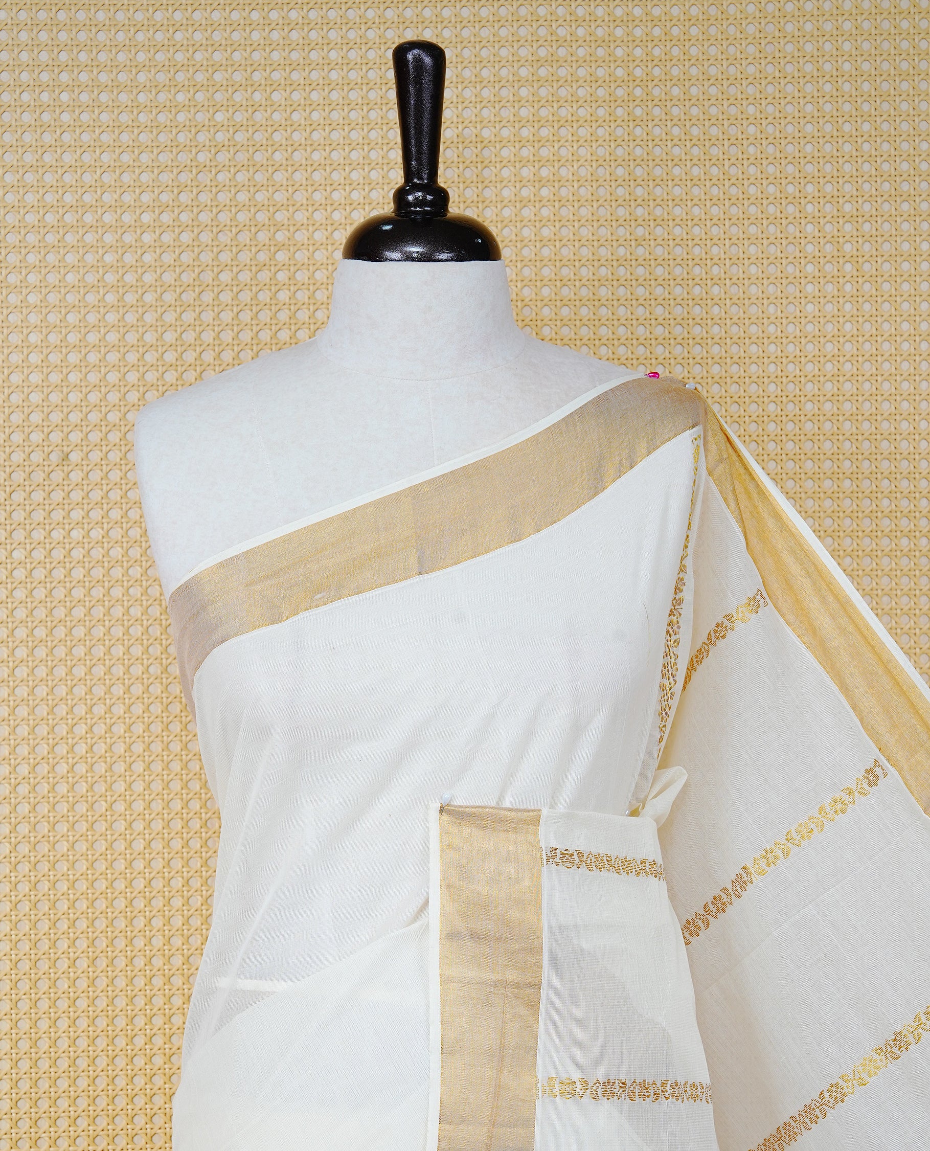 Cream Colour Cotton Kerala Saree Featuring an Elegant Plain Body, a Classy Gold Zari Border, and a Traditional Gold Zari Pallu with Brown Accents, Paired with a Matching Blouse Piece.