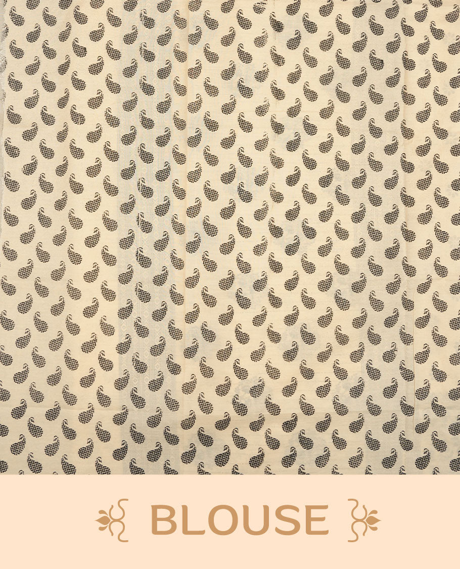 Cream colour poly cotton saree with black floral butti motifs on the body, paired with a matching pallu featuring black ornate floral jaal and stripes on the border, and a coordinated all‑over black paisley printed blouse piece.