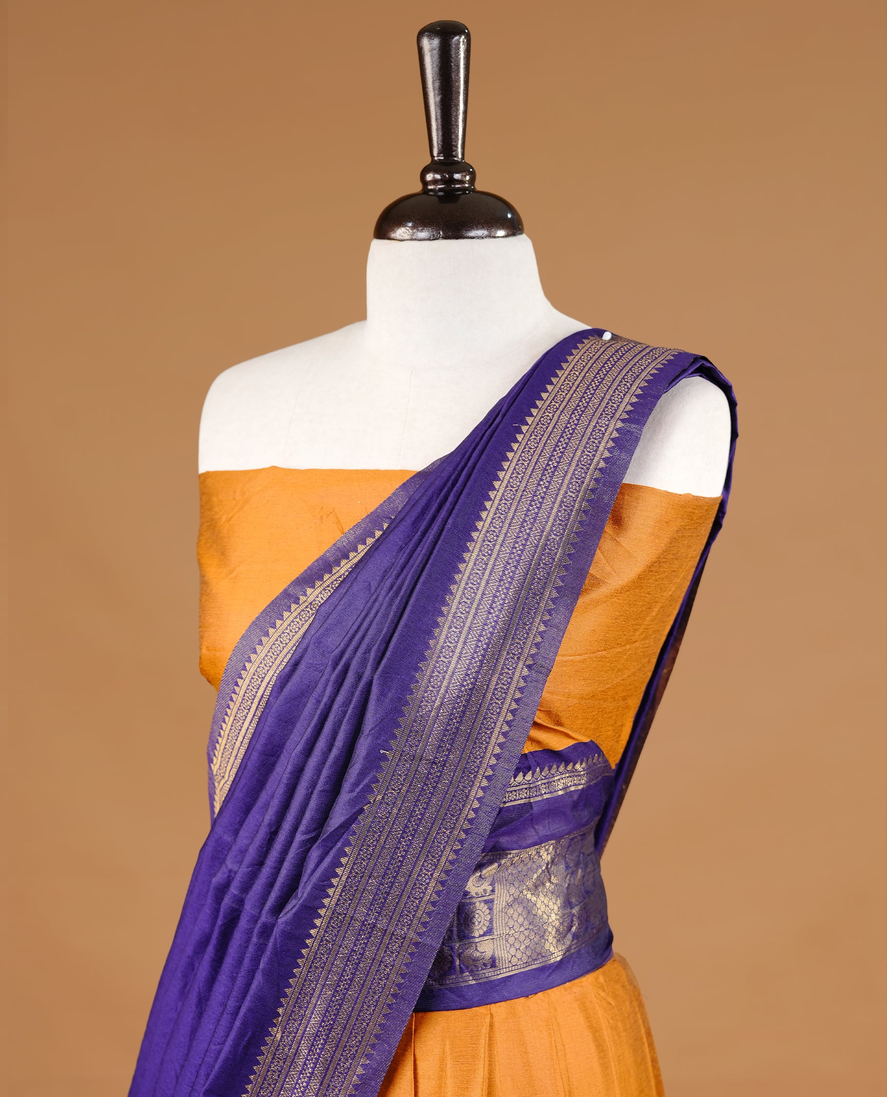 Mustard colour semi stitched Half saree featuring contrast navy blue colour with gold zari traditional border skirt, paired with matching zari border dupatta, unstitched blouse piece