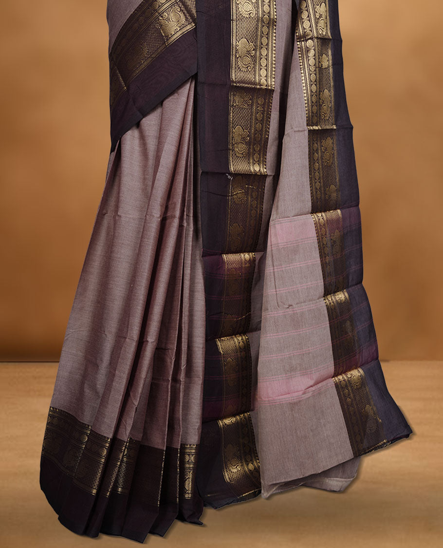 French beige colour chettinad cotton saree featuring plain body, contrast chocolate brown colour with traditional gold zari border without blouse.
