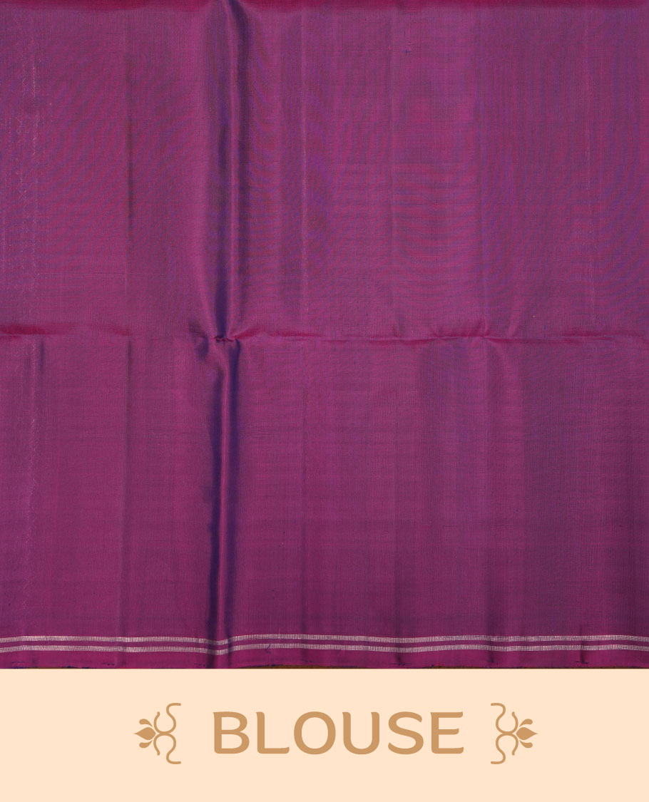 Purple colour soft silk saree featuring gold zari motifs on body, complemented by self colour with traditional border with tassel at pallu, paired with matching blouse piece.