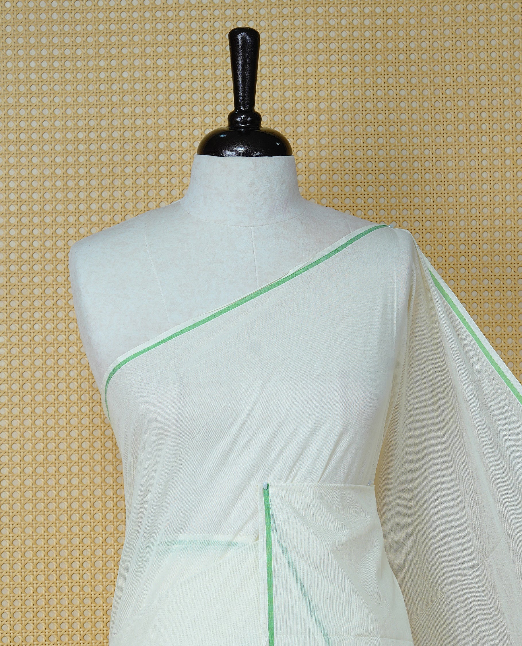 Cream Colour Cotton Kerala Saree Featuring A Classy Plain Body For Effortless Elegance, Enhanced By A Minimalist Light Green Border, Paired With A Matching Blouse Piece