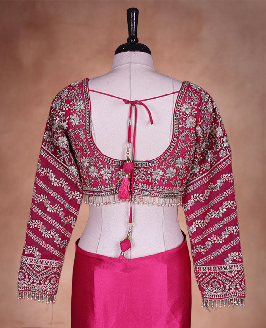 Rani Pink Colour net designer Wedding saree featuring all over floral embroidery with sequin detailing and an ornate scalloped border, finished with a matching embellished blouse.