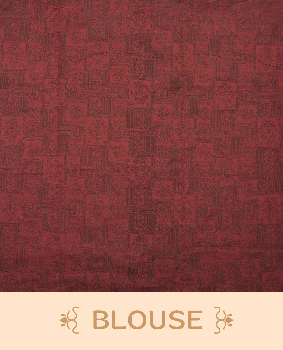 Deep Maroon colour poly cotton saree with black zigzag line pattern on the body, paired with a matching pallu featuring black chevron lines and panelled floral‑paisley design, and a coordinated all‑over floral paisley patch‑style printed blouse piece.