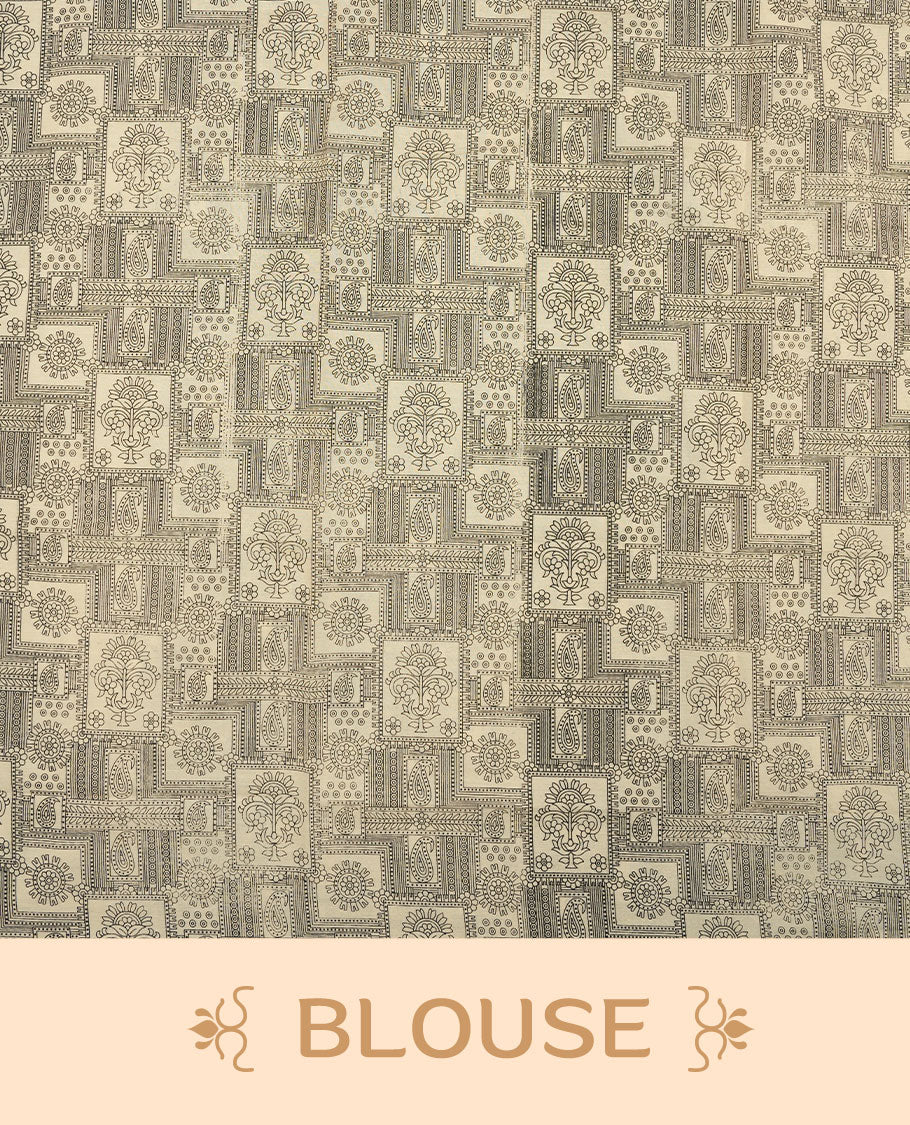 Cream colour poly cotton saree with black zigzag line pattern on the body, paired with a matching pallu featuring black chevron lines and panelled floral‑paisley design, and a coordinated all‑over floral paisley patch‑style printed blouse piece.