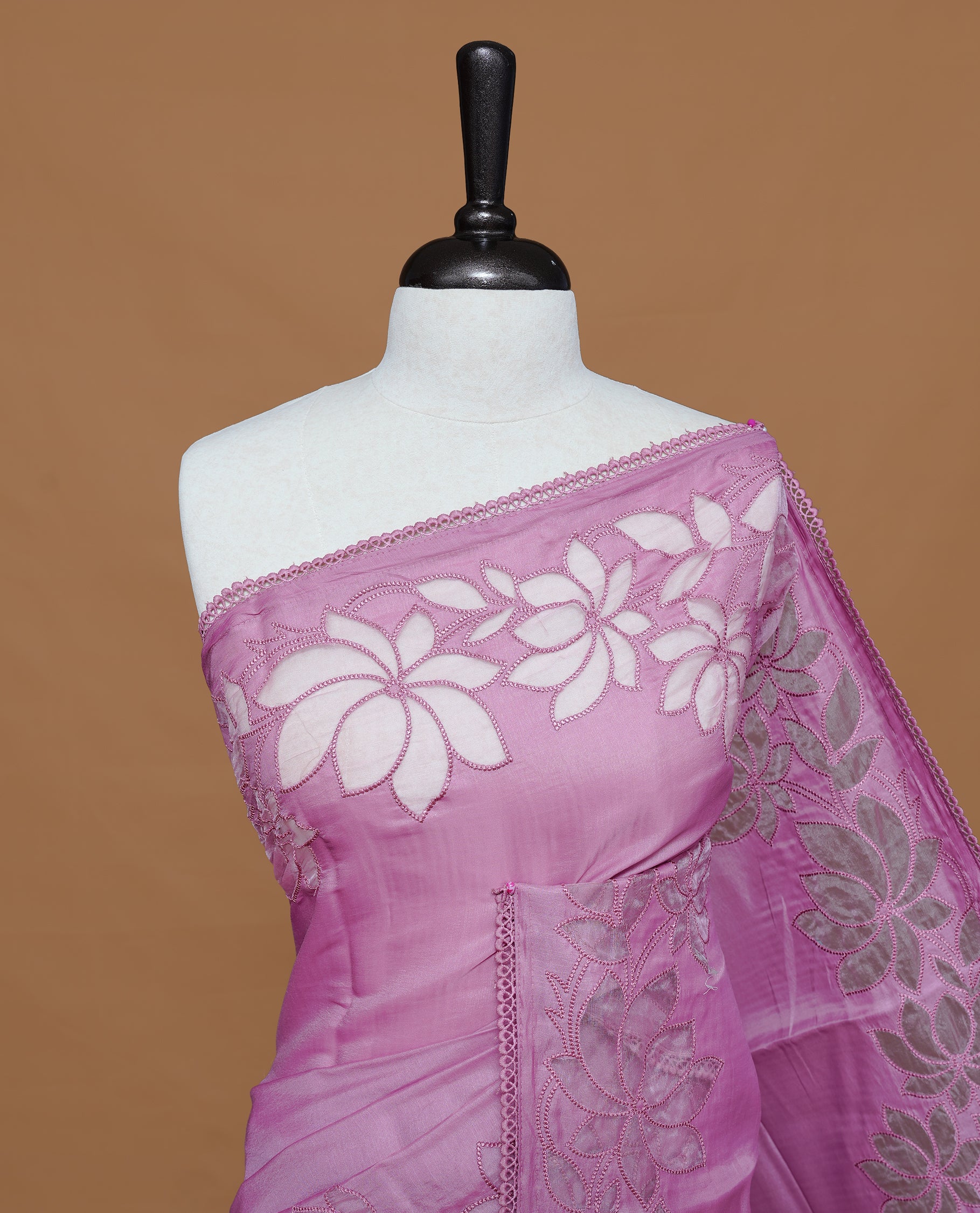 Pastel Pink colour Designer saree Featuring Elegant plain body, enhance with thread Lotus Pattern with lace border, paired with matching blouse piece.