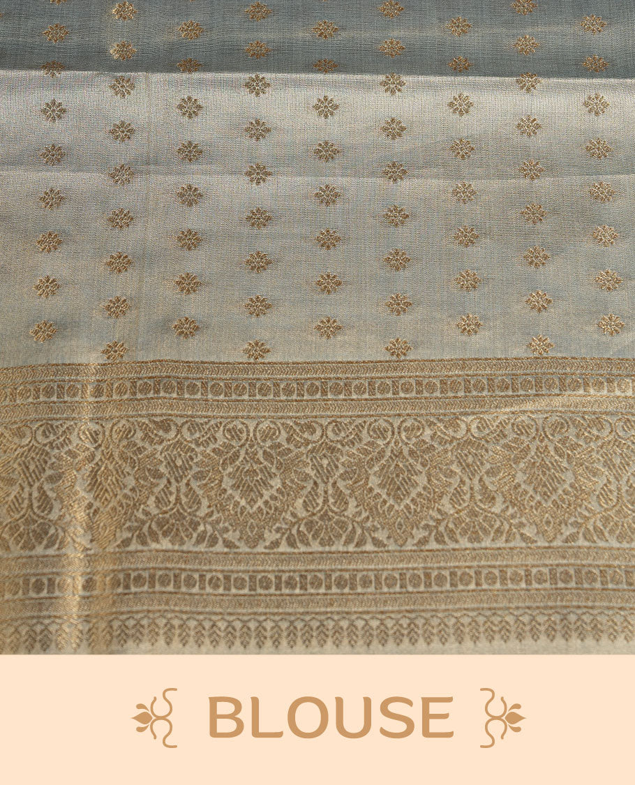 Dual tone light blue and gold colour tissue brocade saree featuring antique gold zari motifs on the body with a rich traditional zari border and pallu, paired with a matching blouse piece.