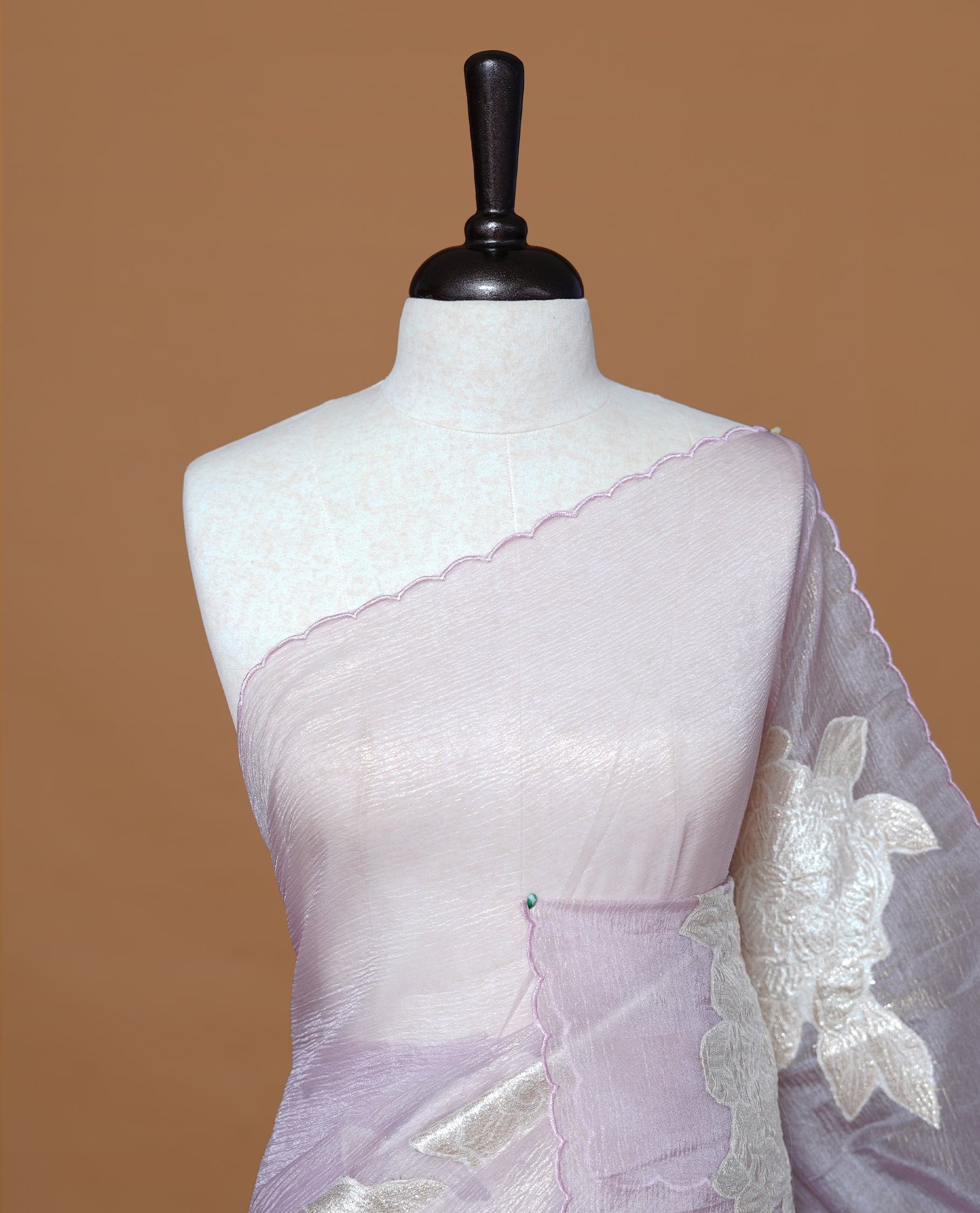 Pastel purple colour Crush Organza Saree featuring White floral Pattern on body, complemented by classy Thread border, paired with matching blouse piece.