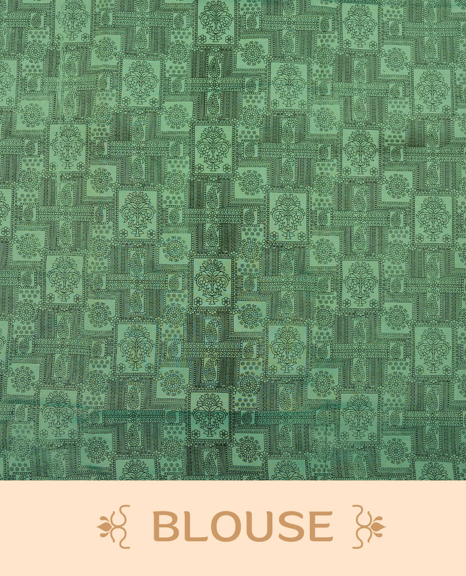 Pista Green colour poly cotton saree with black zigzag line pattern on the body, paired with a matching pallu featuring black chevron lines and panelled floral‑paisley design, and a coordinated all‑over floral paisley patch‑style printed blouse piece.