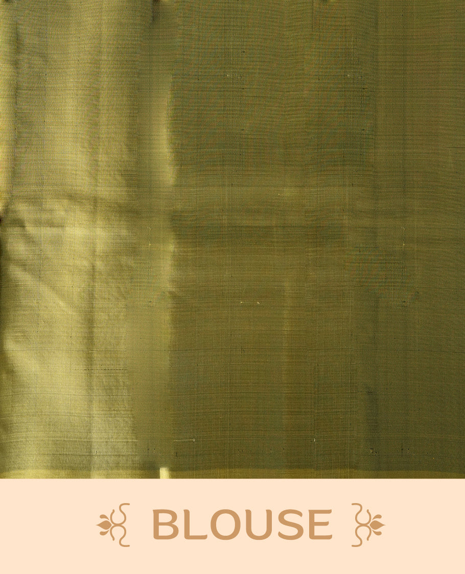 Maroon colour soft silk saree adorned with small golden buttas, enhanced by a shimmering light olive green zari border and pallu with delicate motifs & paired with a matching blouse.