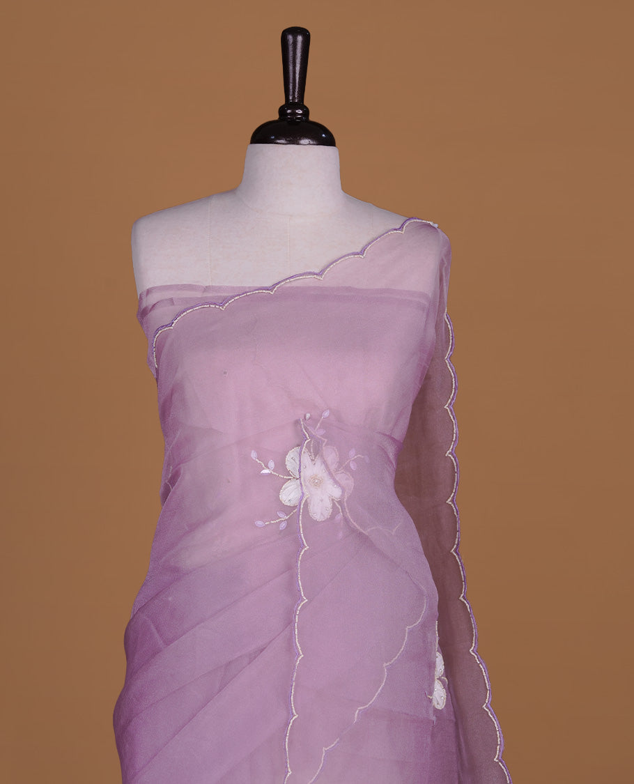 Pastel lavender colour crush organza saree featuring white floral work with beats & sequins, highlighting scalp with beats worked border, paired with matching blouse piece.