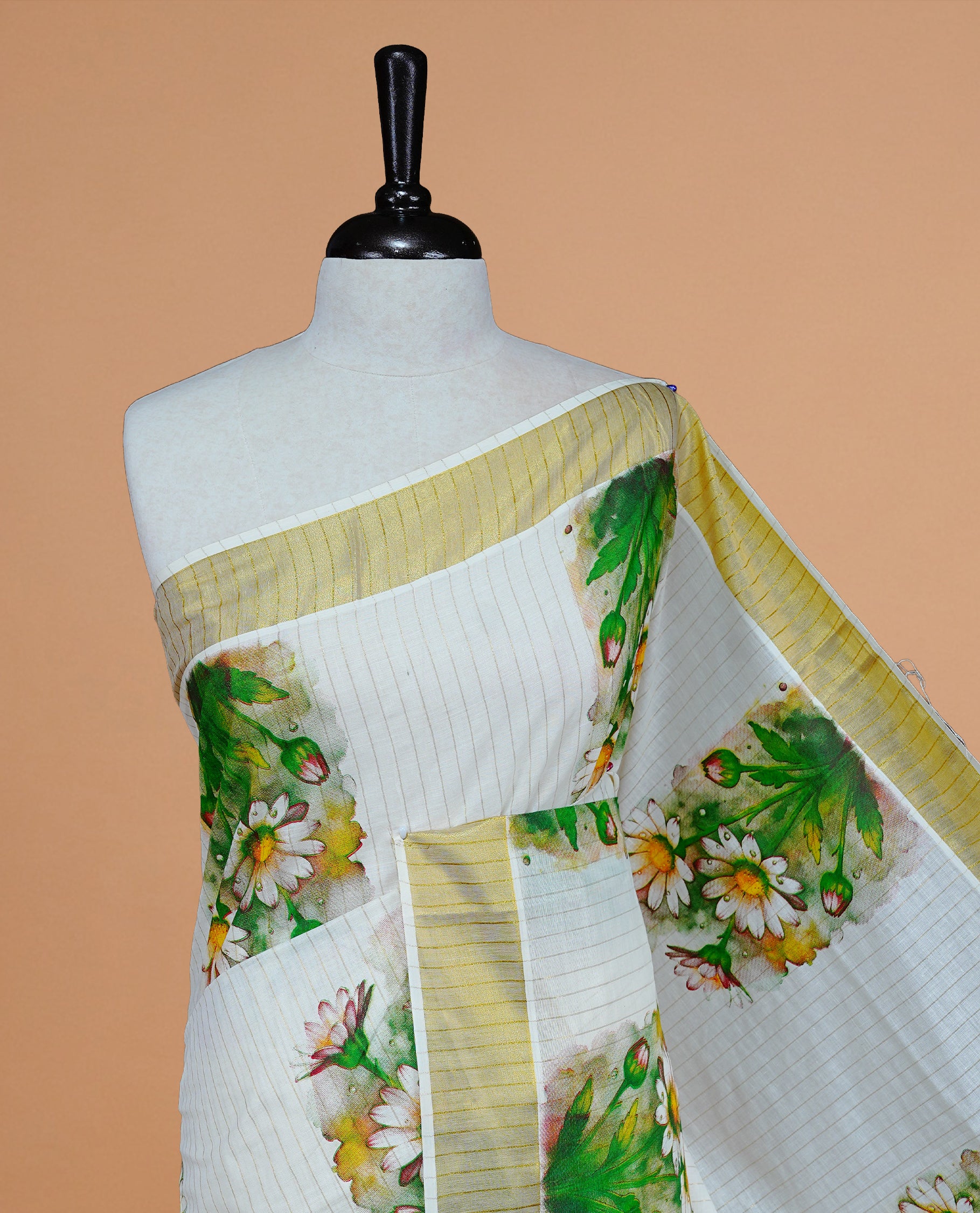 Cream Colour Kerala Saree Featuring Gold Stripes On The Body, Complemented By A Traditional Gold Zari And Floral Printed Border, Paired With A Matching Blouse Piece.