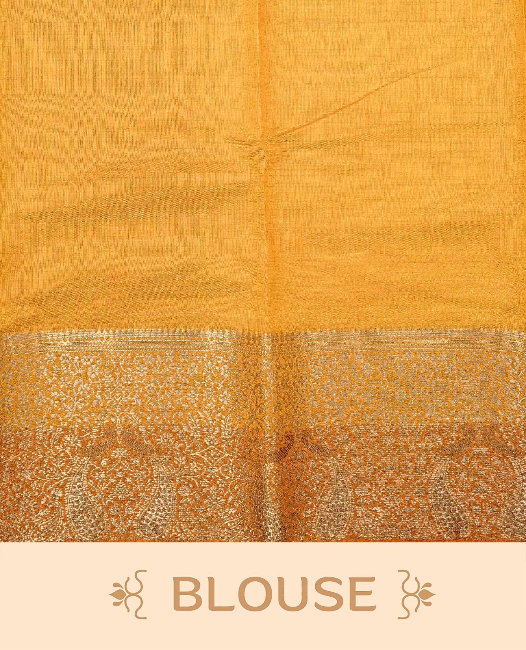 Light gold tussar saree featuring Elegant plain body, complemented by contrast Orange yellow colour with Gold zari Floral kodi with Peacock Pattern border, comes with matching blouse piece.