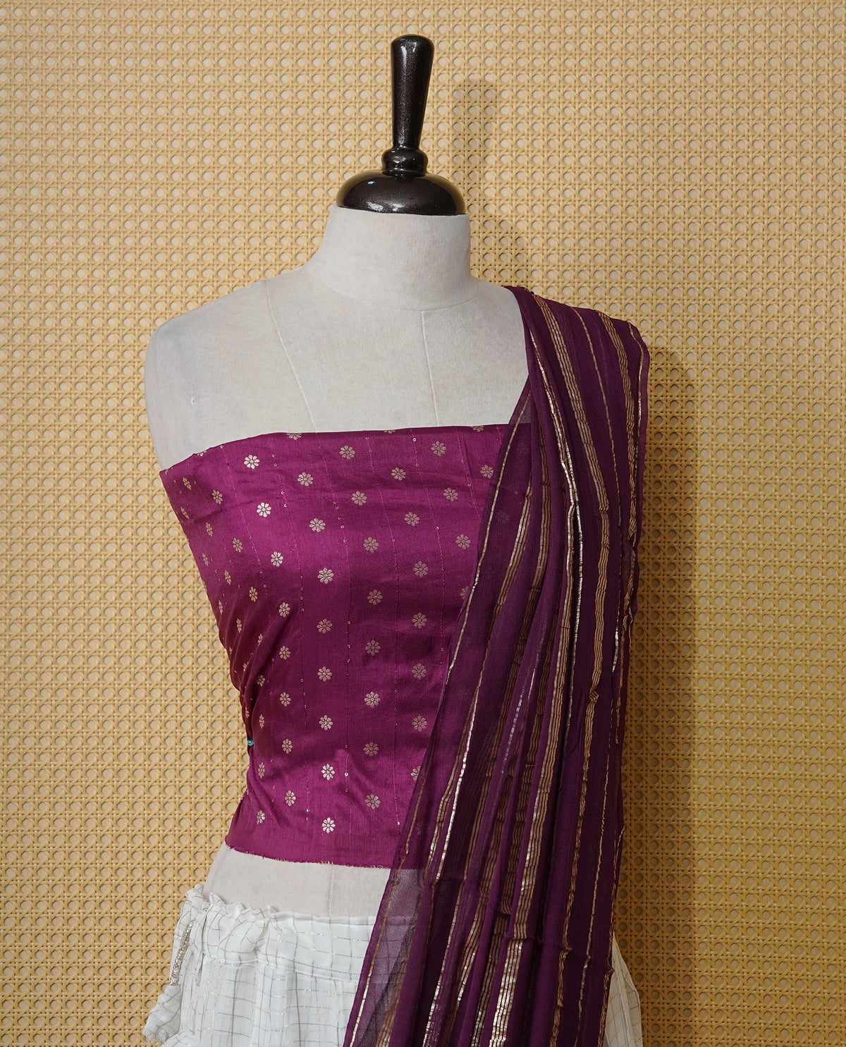 Off white colour Semi stitched dhavani set featuring Gold zari check pattern with contrast Purple border skirt, paired with matching blouse & dupatta.