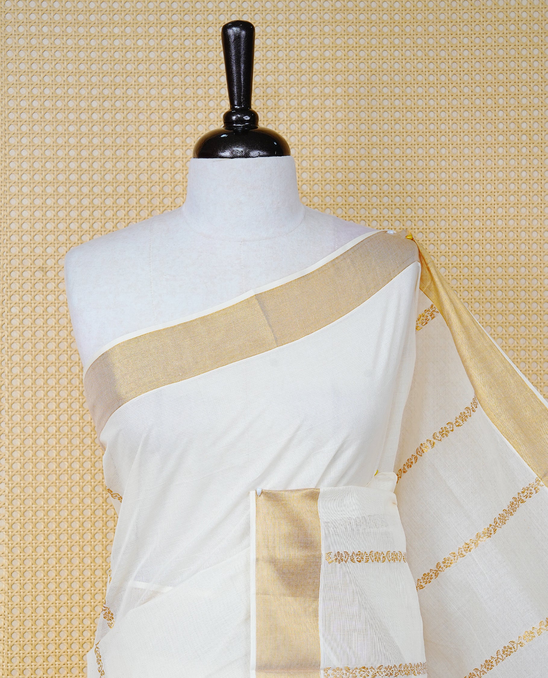 Cream Colour Cotton Kerala Saree Featuring an Elegant Plain Body, a Classy Gold Zari Border, and a Traditional Gold Zari Pallu with Maroon Accents, Paired with a Matching Blouse Piece.
