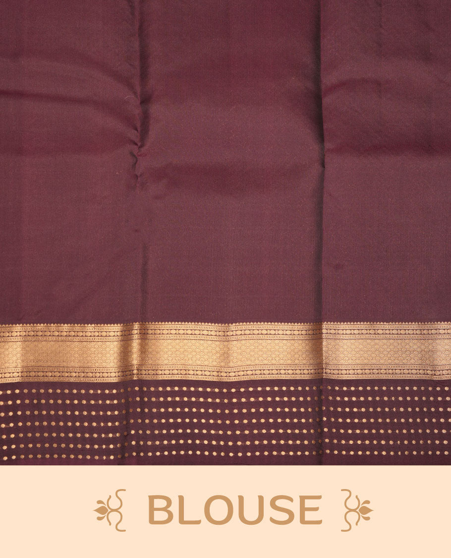 Green colour Vasundhara silk saree featuring gold zari buttas on body, complemented by contrast burgundy colour zari border, paired with matching blouse piece.
