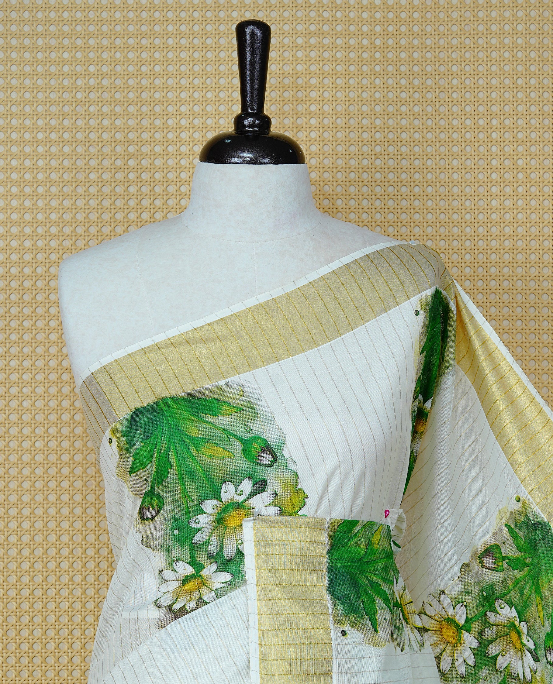 Cream Colour Cotton Kerala Saree Featuring A Light Gold Zari Pattern And Floral Prints On The Body, Enhanced By A Traditional Zari Border And Pallu, Paired With A Matching Blouse Piece