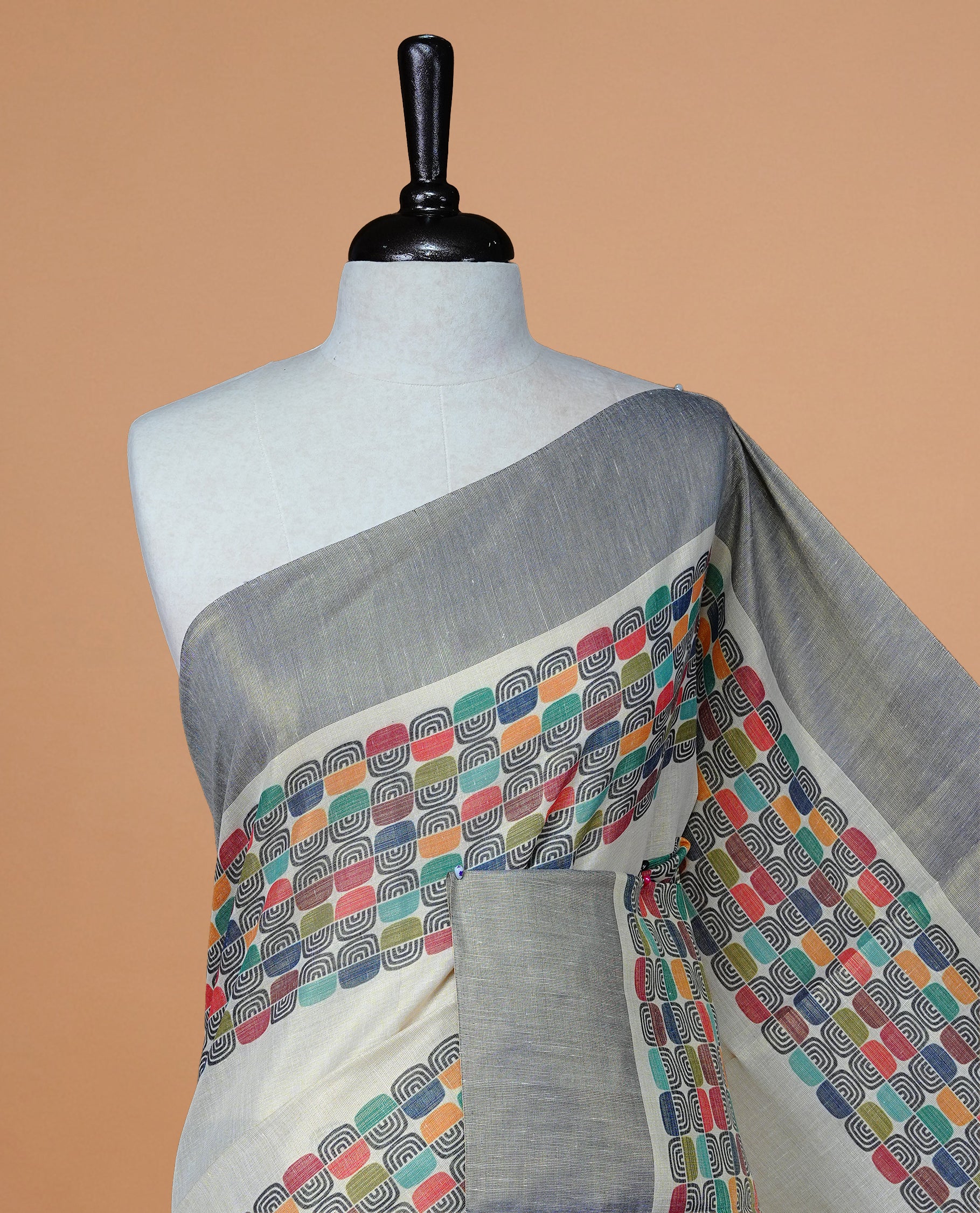 Cream colour Tissue kerala saree featuring Classy Multi colour Box pattern on body, Styled by navy blue & gold zari border and pallu, comes with matching blouse piece.