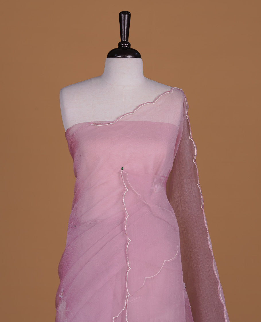 Pink colour crush organza saree featuring white floral work with beats & sequins, highlighting scalp with beats worked border, paired with matching blouse piece.