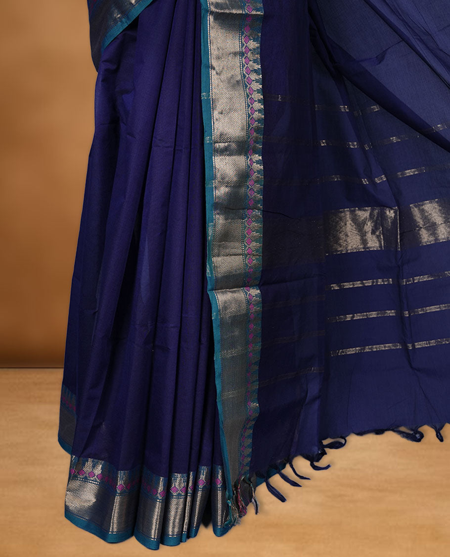 Navy Blue colour chettinad cotton saree featuring Elegant plain body, contrast green colour border with gold zari border, pallu and paired with matching blouse.