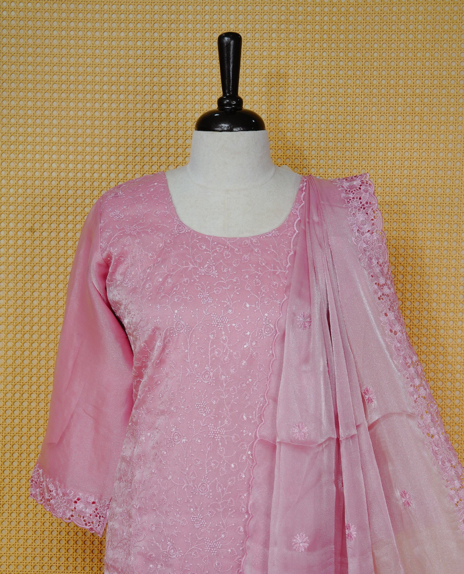 Onion Pink colour churidar set with delicate floral embroidery on the kurta, lace-trimmed sleeves and hem, paired with a matching embroidered dupatta and solid pants.