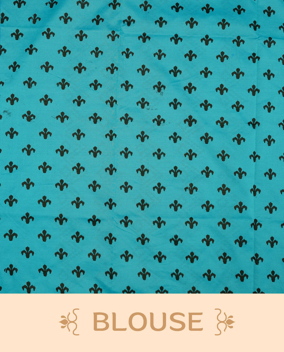 Teal blue colour poly cotton saree with black vertical dotted line pattern on the body, paired with a matching pallu featuring black zigzag geometric border, and a coordinated all‑over black stylised fleur‑de‑lis printed blouse piece.