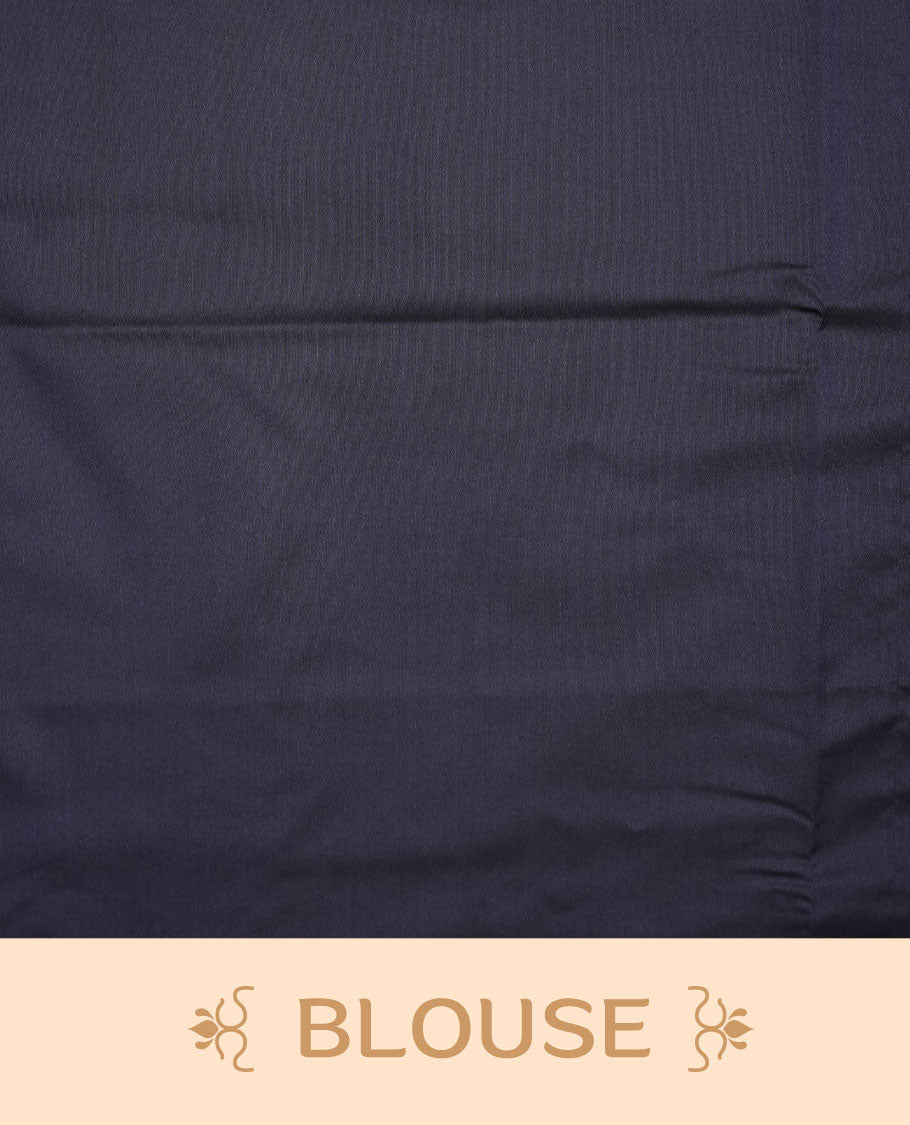 Mustard colour soft silk saree features a sleek borderless design with intricate antique zari motifs, flowing into a striking contrast blue pallu and a matching blouse piece.