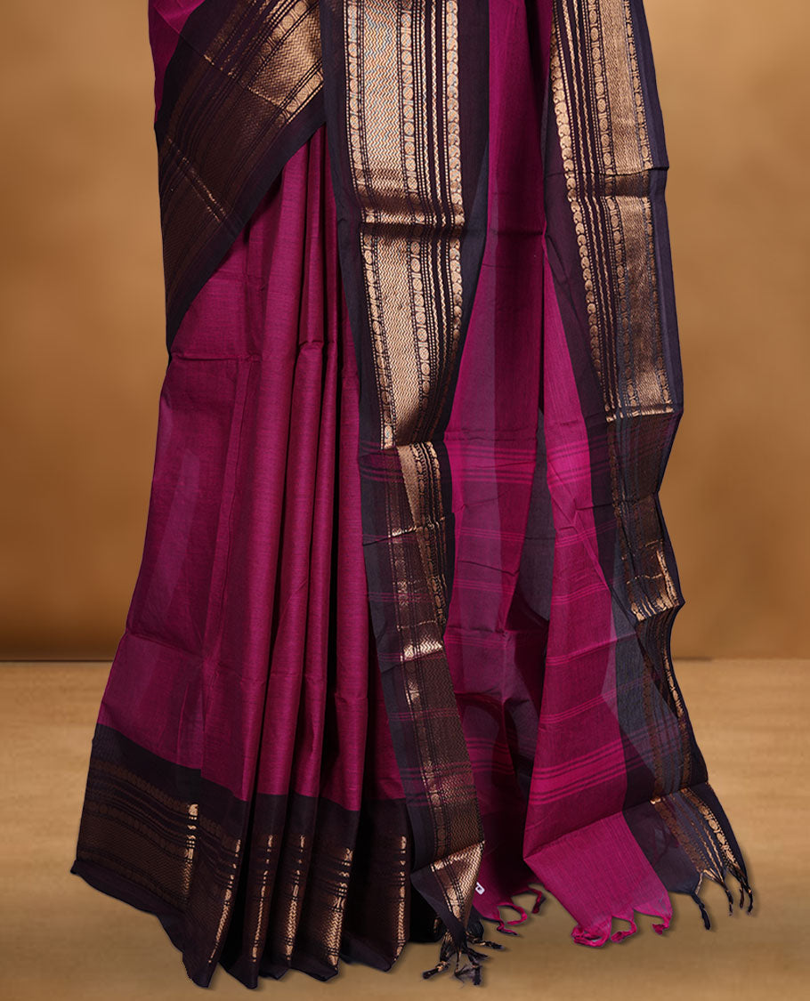 Dark Magenta colour chettinad cotton saree featuring plain body, contrast Dark brown colour with traditional gold zari border paired with matching blouse.