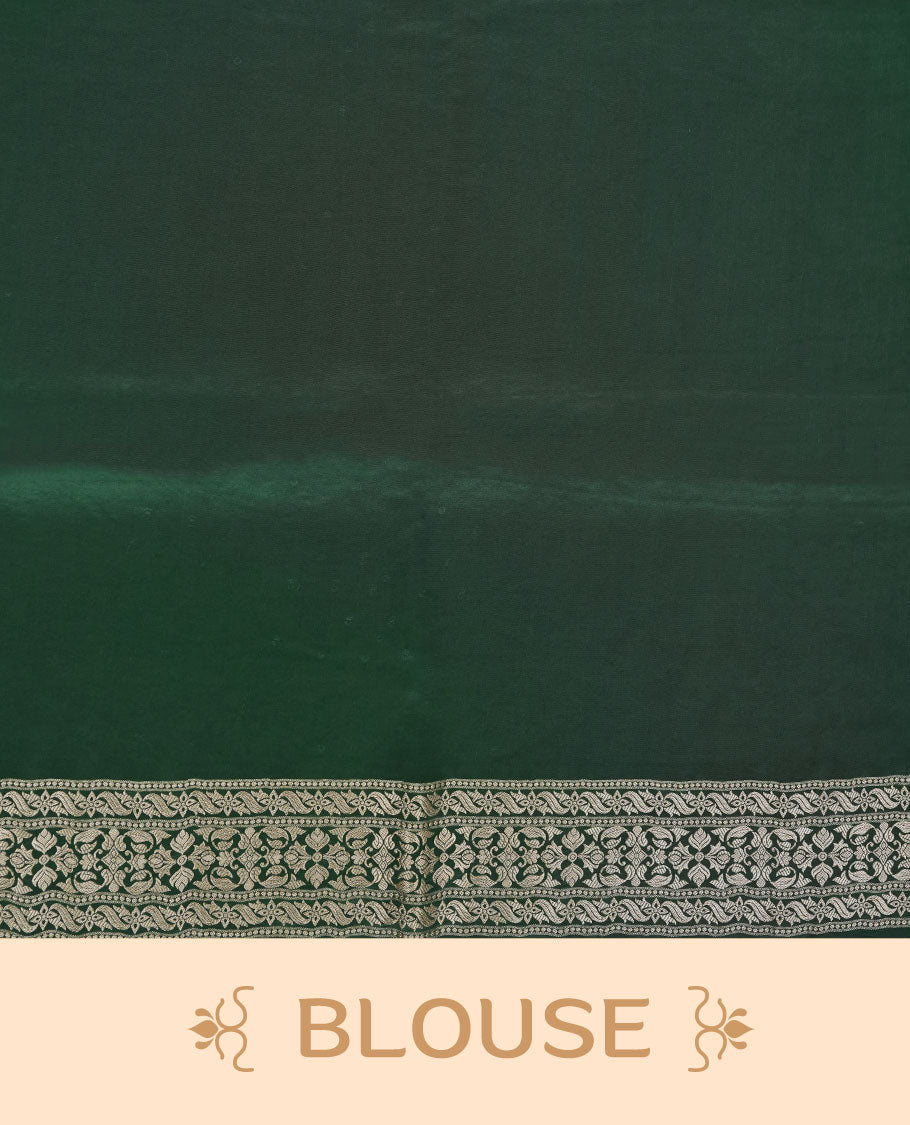 Dark green colour banaras satin crepe saree featuring gold zari pattern across body, with self colour border with gold zari pattern and paired with matching blouse.