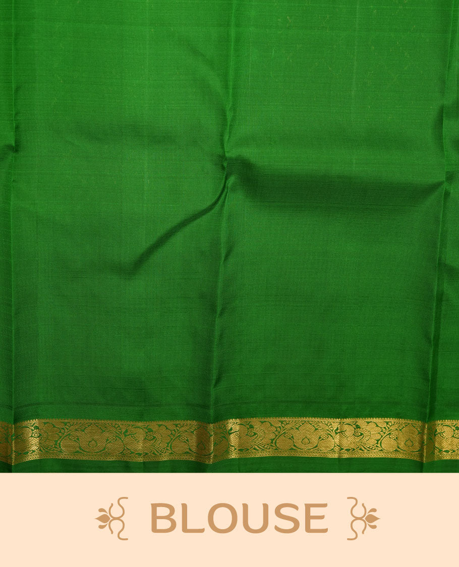 Mustard yellow pure traditional Kancheepuram silk saree adorned with gold zari motifs across the body, featuring elegant and simple contrast light green zari traditional borders, beautifully paired with a matching blouse piece.
